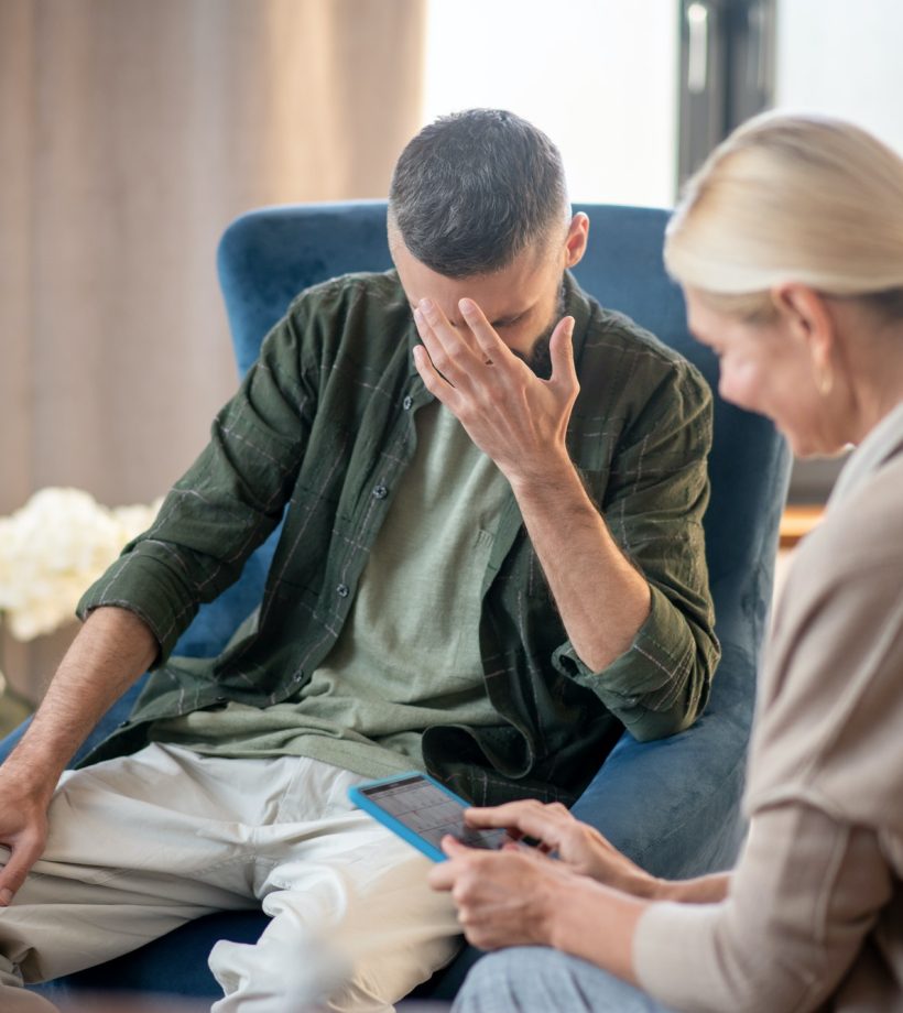 blonde-haired-psychoanalyst-helping-a-man-with-depression.jpg